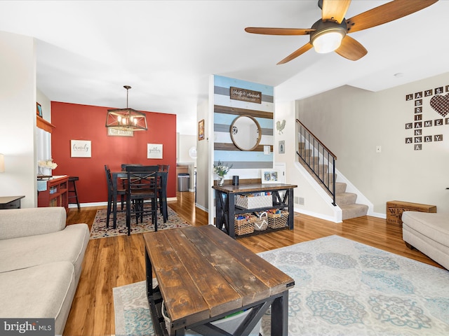 2524 Vineyard Ln, Crofton, MD 21114 - living area with stairway, wood finished floors, a chandelier, and ceiling fan