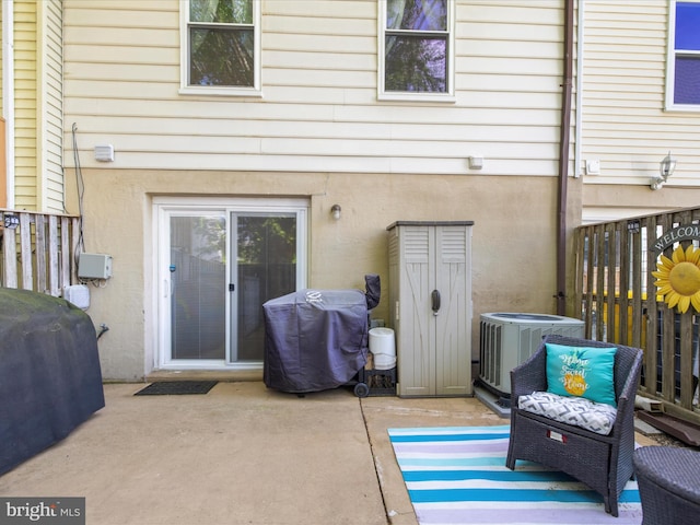 2524 Vineyard Ln, Crofton, MD 21114 - rear view of house with cooling unit, a patio, and stucco siding