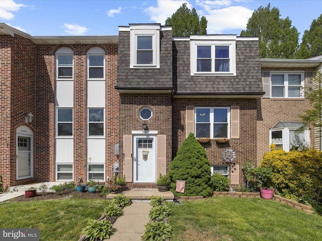 2524 Vineyard Ln, Crofton, MD 21114 - view of front of home featuring roof with shingles, brick siding, and a front lawn