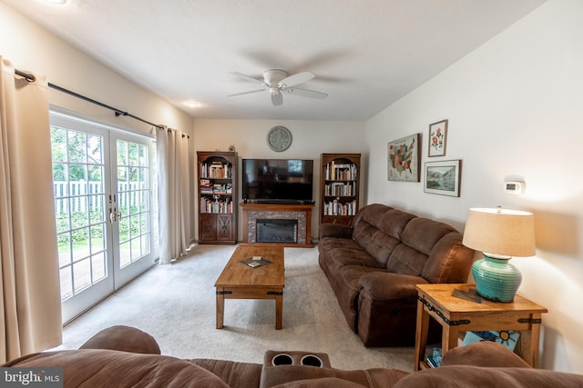 705 Hemlock Ct, Hanover, PA 17331 - carpeted living area with a ceiling fan, french doors, and a glass covered fireplace