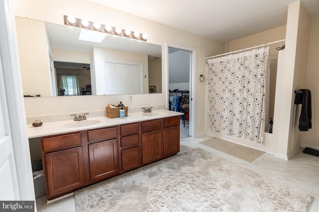 705 Hemlock Ct, Hanover, PA 17331 - bathroom featuring double vanity, marble look tile flooring, and shower / bath combination with curtain