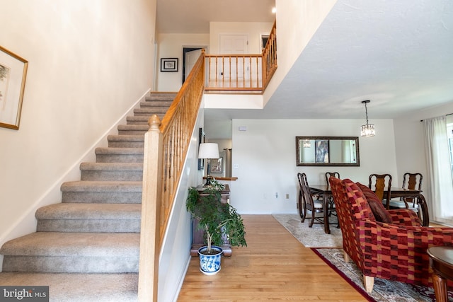 705 Hemlock Ct, Hanover, PA 17331 - stairs featuring wood finished floors and a towering ceiling