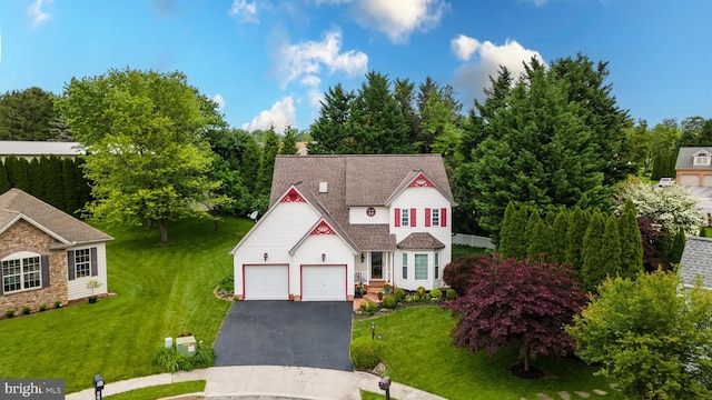 705 Hemlock Ct, Hanover, PA 17331 - traditional-style house featuring asphalt driveway, a front yard, and a garage
