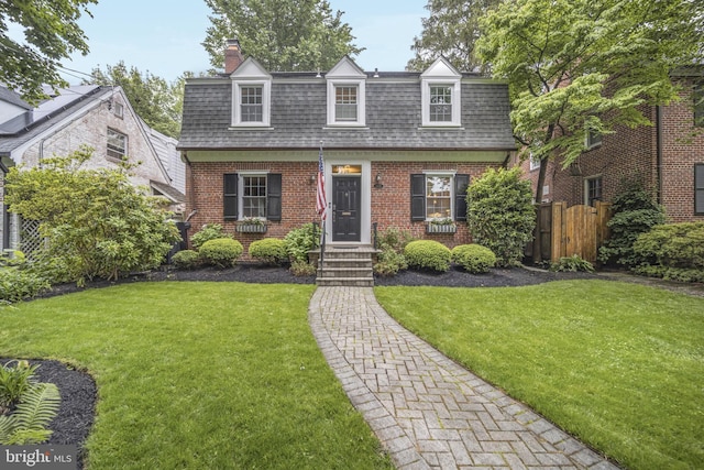 4831 Alton Pl NW, Washington, DC 20016 - view of front of home with mansard roof, roof with shingles, a chimney, and brick siding