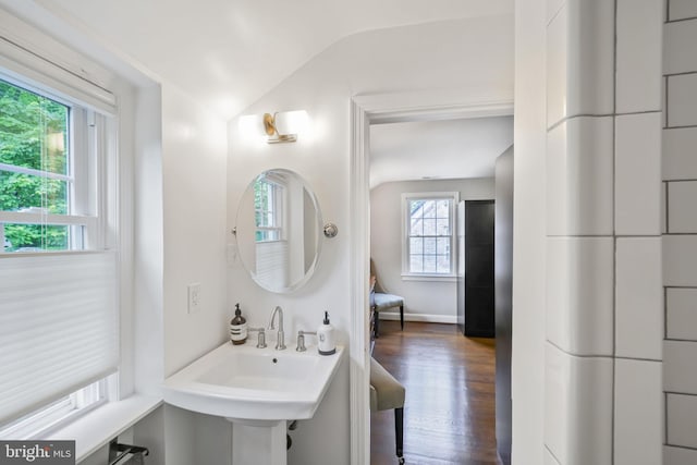 4831 Alton Pl NW, Washington, DC 20016 - bathroom featuring healthy amount of natural light, vaulted ceiling, wood finished floors, and baseboards