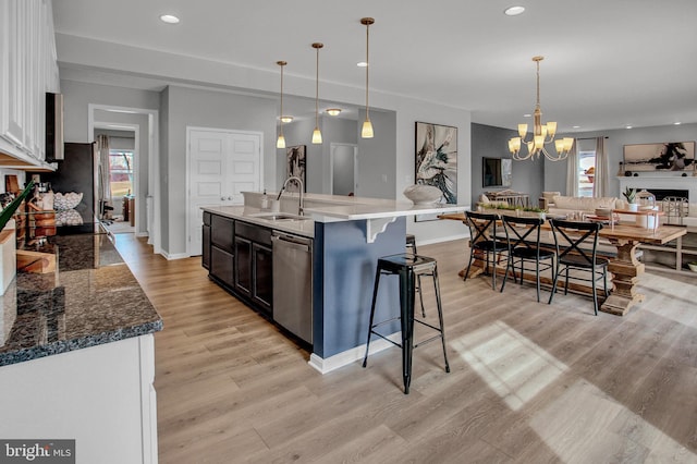 128 Fred Dr, North East, MD 21901 - kitchen with a sink, stainless steel dishwasher, open floor plan, light wood finished floors, and baseboards