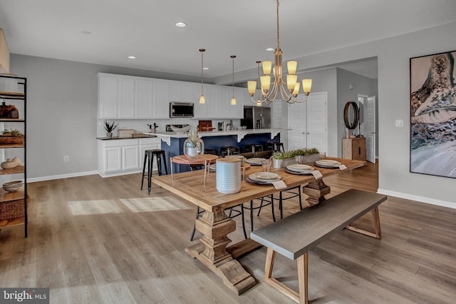 128 Fred Dr, North East, MD 21901 - dining room featuring a chandelier, baseboards, recessed lighting, and light wood-style flooring