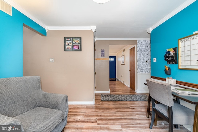 office with crown molding, wood finished floors, and baseboards