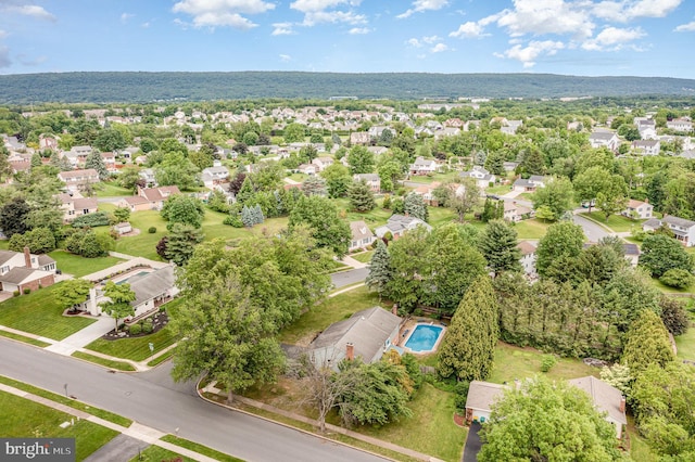 aerial view of residential area with a pool
