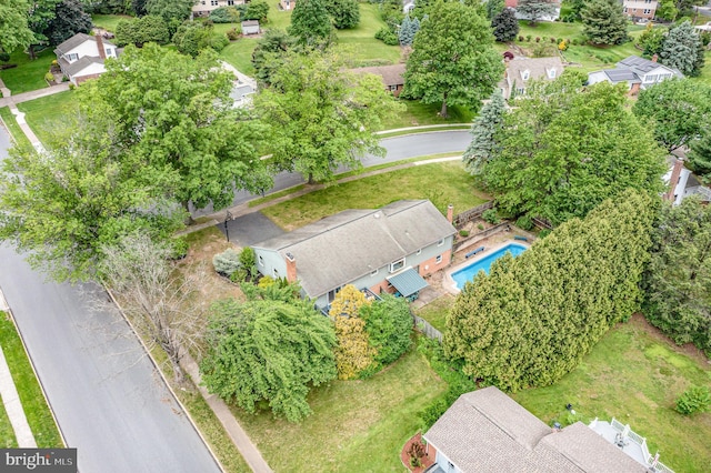 view of property location featuring nearby suburban area and a pool area