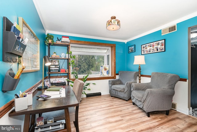 home office featuring ornamental molding, wood finished floors, and baseboards