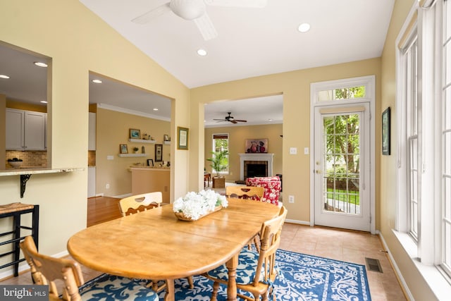 21381 Chickacoan Trail Dr, Broadlands, VA 20148 - dining room featuring ceiling fan, recessed lighting, vaulted ceiling, a brick fireplace, and baseboards