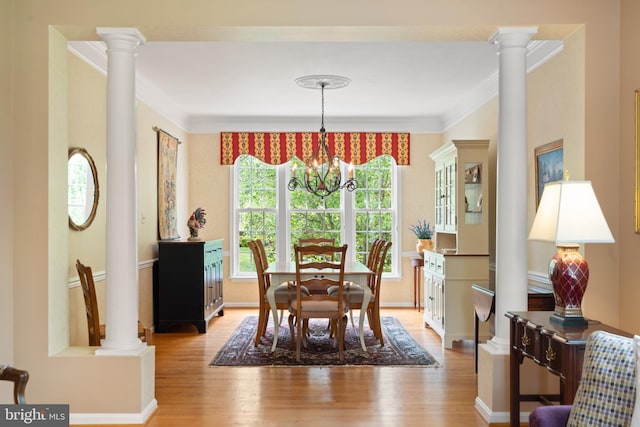 21381 Chickacoan Trail Dr, Broadlands, VA 20148 - dining room featuring crown molding, a chandelier, light wood finished floors, and decorative columns
