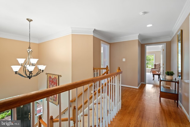 21381 Chickacoan Trail Dr, Broadlands, VA 20148 - corridor with an upstairs landing, light wood finished floors, a chandelier, baseboards, and ornamental molding
