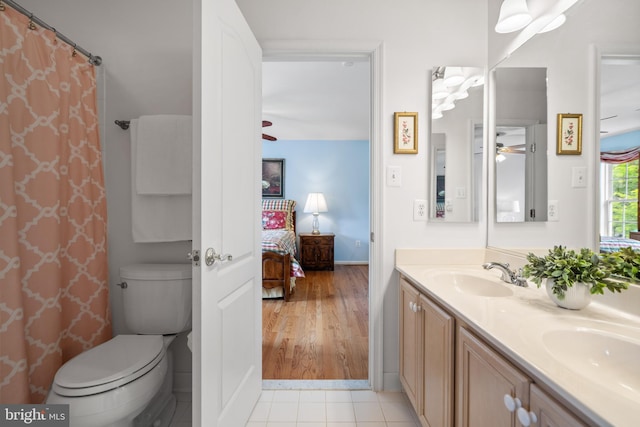 21381 Chickacoan Trail Dr, Broadlands, VA 20148 - bathroom with a ceiling fan, double vanity, toilet, ensuite bath, and baseboards