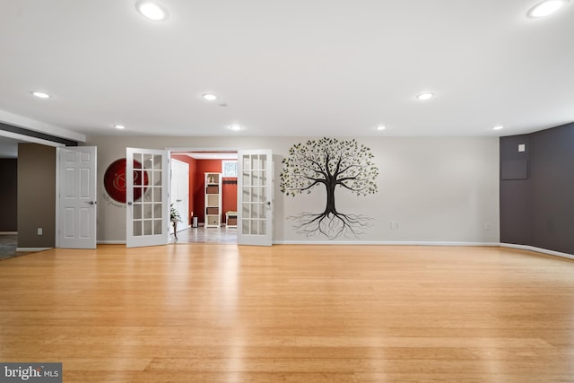 21381 Chickacoan Trail Dr, Broadlands, VA 20148 - empty room featuring light wood-style floors, french doors, recessed lighting, and baseboards