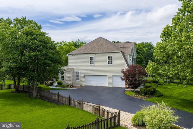 21381 Chickacoan Trail Dr, Broadlands, VA 20148 - view of home's exterior with a garage, driveway, and roof with shingles