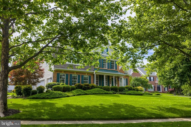 21381 Chickacoan Trail Dr, Broadlands, VA 20148 - view of front facade with brick siding and a front yard