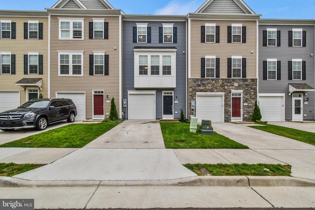 121 Stribling Way, Winchester, VA 22602 - townhome / multi-family property featuring driveway, a garage, and stone siding