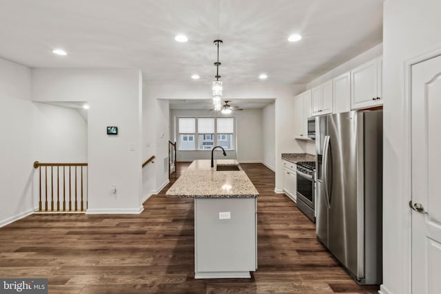 121 Stribling Way, Winchester, VA 22602 - kitchen featuring stainless steel appliances, a sink, white cabinets, light stone counters, and recessed lighting