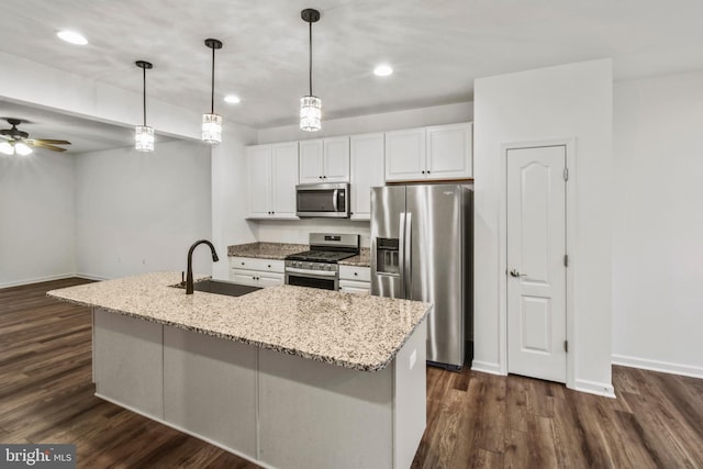 121 Stribling Way, Winchester, VA 22602 - kitchen with stainless steel appliances, a sink, white cabinetry, dark wood-style floors, and baseboards