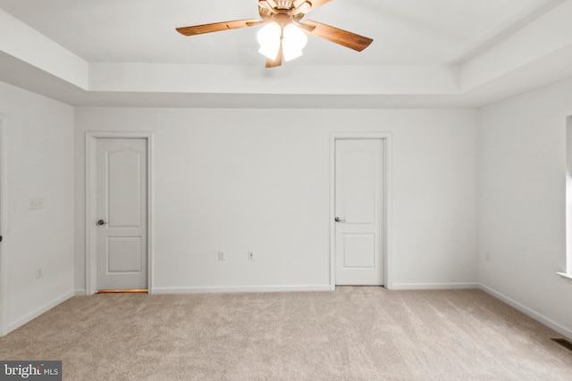 121 Stribling Way, Winchester, VA 22602 - empty room with light colored carpet, a tray ceiling, ceiling fan, and baseboards
