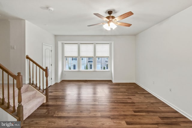 121 Stribling Way, Winchester, VA 22602 - spare room with ceiling fan, dark wood finished floors, baseboards, and stairway