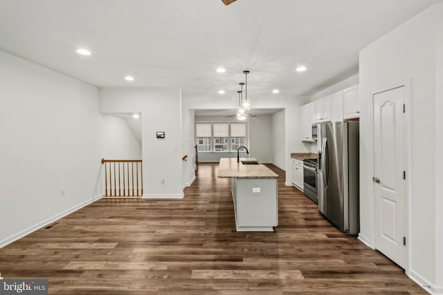 121 Stribling Way, Winchester, VA 22602 - kitchen featuring appliances with stainless steel finishes, recessed lighting, white cabinetry, dark wood-style flooring, and an island with sink