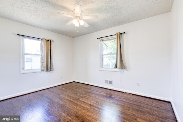 2 Idlewood St, Glen Burnie, MD 21061 - unfurnished room with dark wood-style flooring, baseboards, ceiling fan, and a textured ceiling
