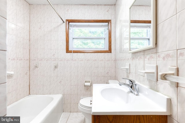 2 Idlewood St, Glen Burnie, MD 21061 - full bath with tile walls, plenty of natural light, toilet, a bath, and vanity