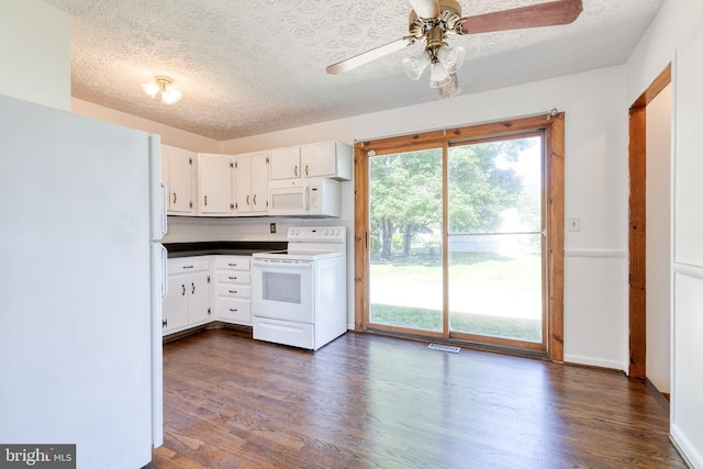 2 Idlewood St, Glen Burnie, MD 21061 - kitchen with white appliances, a textured ceiling, dark wood-style flooring, white cabinets, and dark countertops