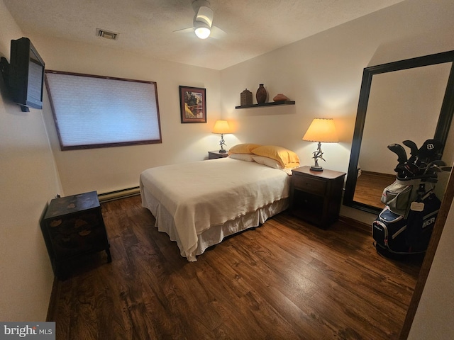 939 Glendale Rd Unit 13, Oakland, MD 21550 - bedroom with wood finished floors, baseboard heating, and ceiling fan