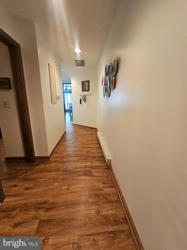 939 Glendale Rd Unit 13, Oakland, MD 21550 - corridor with a baseboard radiator, wood finished floors, and baseboards