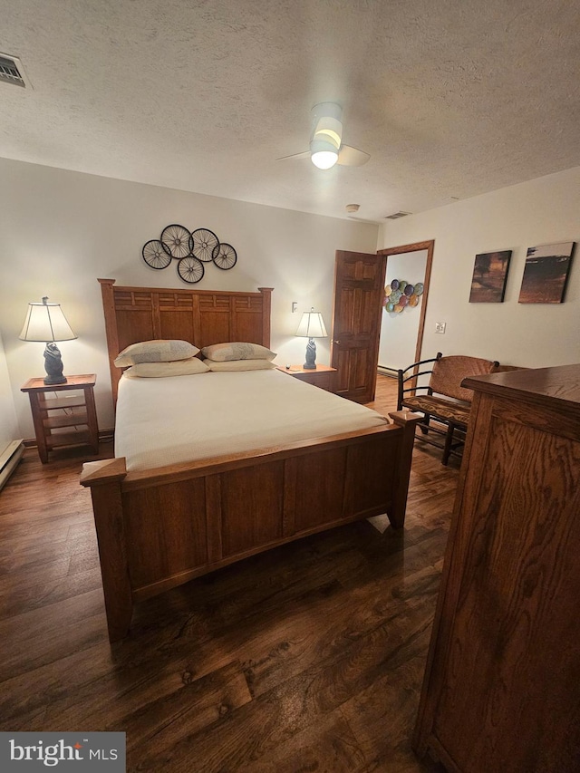 939 Glendale Rd Unit 13, Oakland, MD 21550 - bedroom with dark wood-style floors, a textured ceiling, ceiling fan, and baseboards