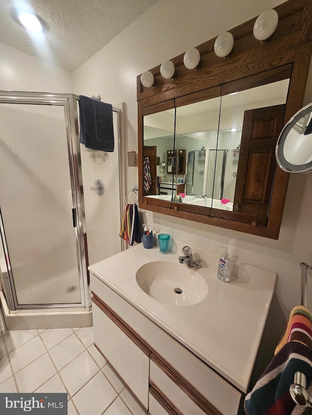 939 Glendale Rd Unit 13, Oakland, MD 21550 - bathroom with vanity, a shower stall, tile patterned flooring, and a textured ceiling