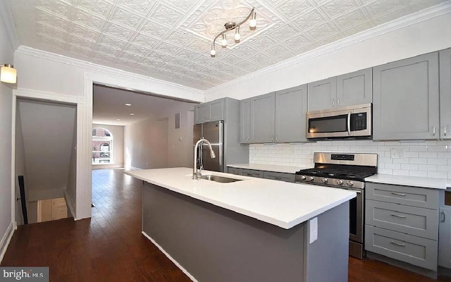 217 S E Ave S, Baltimore, MD 21224 - kitchen with stainless steel appliances, gray cabinetry, an ornate ceiling, a sink, and tasteful backsplash