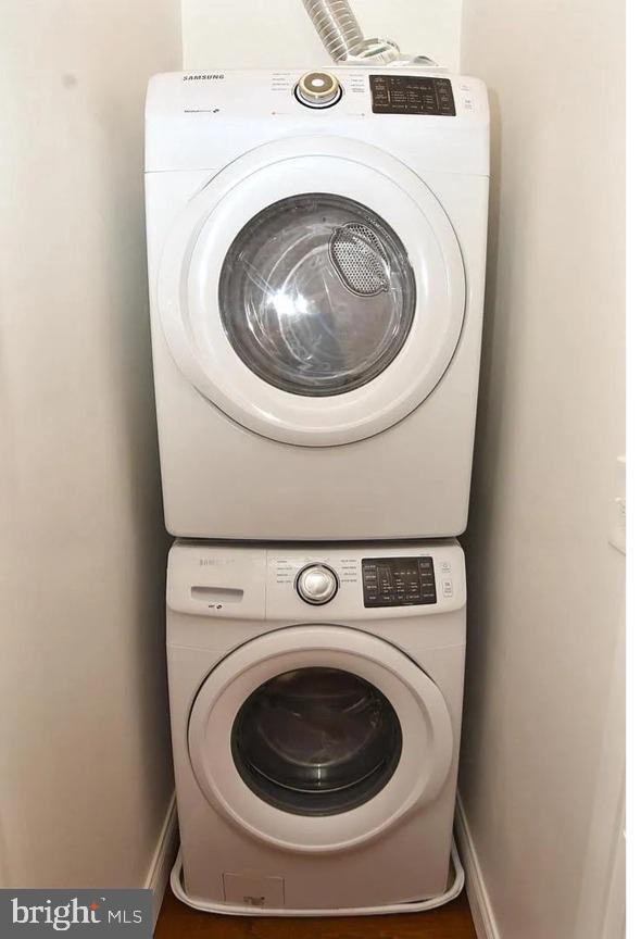 217 S E Ave S, Baltimore, MD 21224 - washroom with stacked washer / dryer and baseboards