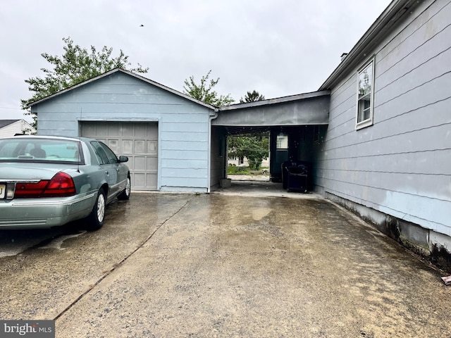 35 Farnsworth Ave, Maple Shade, NJ 08052 - garage with concrete driveway and a carport