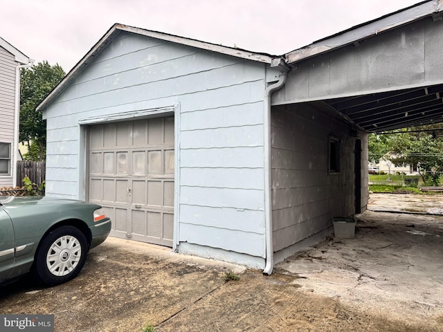 35 Farnsworth Ave, Maple Shade, NJ 08052 - garage with concrete driveway and a carport