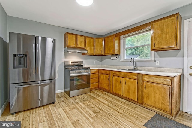 3176 S Hance Bridge Rd, Vineland, NJ 08361 - kitchen with stainless steel appliances, a sink, under cabinet range hood, and light countertops
