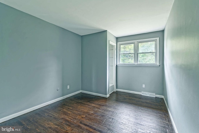 3176 S Hance Bridge Rd, Vineland, NJ 08361 - spare room featuring dark wood-style flooring and baseboards