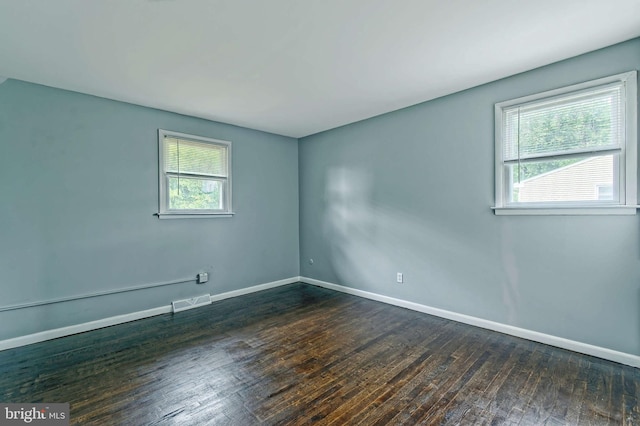 3176 S Hance Bridge Rd, Vineland, NJ 08361 - empty room with dark wood-type flooring and baseboards