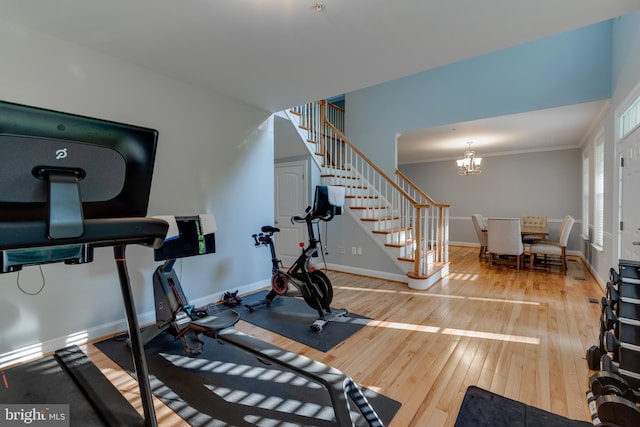 3565 Sauvignon Ln, Chesapeake Beach, MD 20732 - workout room featuring hardwood / wood-style flooring, baseboards, a chandelier, and crown molding