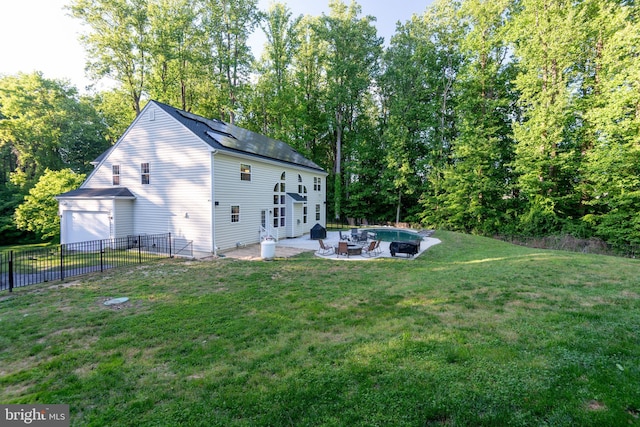 3565 Sauvignon Ln, Chesapeake Beach, MD 20732 - rear view of property featuring a patio, a fire pit, and a shingled roof