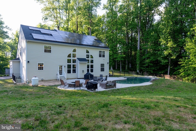3565 Sauvignon Ln, Chesapeake Beach, MD 20732 - rear view of house featuring a patio, entry steps, solar panels, and an outdoor pool