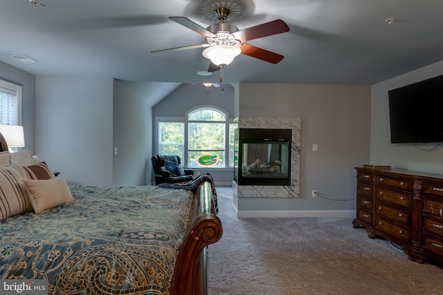 3565 Sauvignon Ln, Chesapeake Beach, MD 20732 - carpeted bedroom with baseboards, a ceiling fan, a high end fireplace, and lofted ceiling