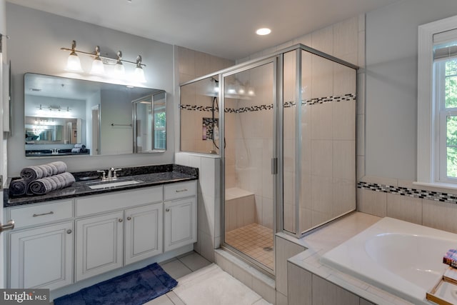 3565 Sauvignon Ln, Chesapeake Beach, MD 20732 - bathroom with a stall shower, a bath, vanity, tile patterned floors, and recessed lighting