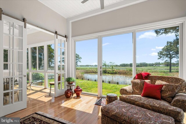 30558 Luff Ln Unit C-14, Ocean View, DE 19970 - sunroom featuring a water view, wood finished floors, and plenty of natural light