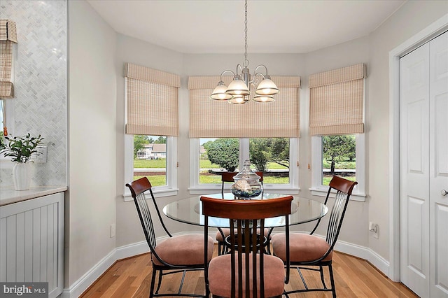 30558 Luff Ln Unit C-14, Ocean View, DE 19970 - dining space with light wood-type flooring, a chandelier, healthy amount of natural light, and baseboards