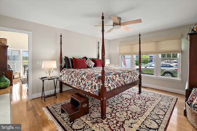 30558 Luff Ln Unit C-14, Ocean View, DE 19970 - bedroom with multiple windows, light wood finished floors, and baseboards